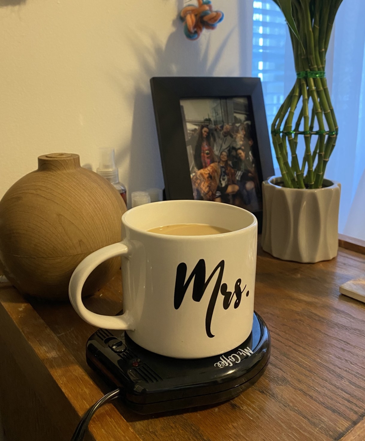 a reviewer&#x27;s image of their mug on the mug warmer