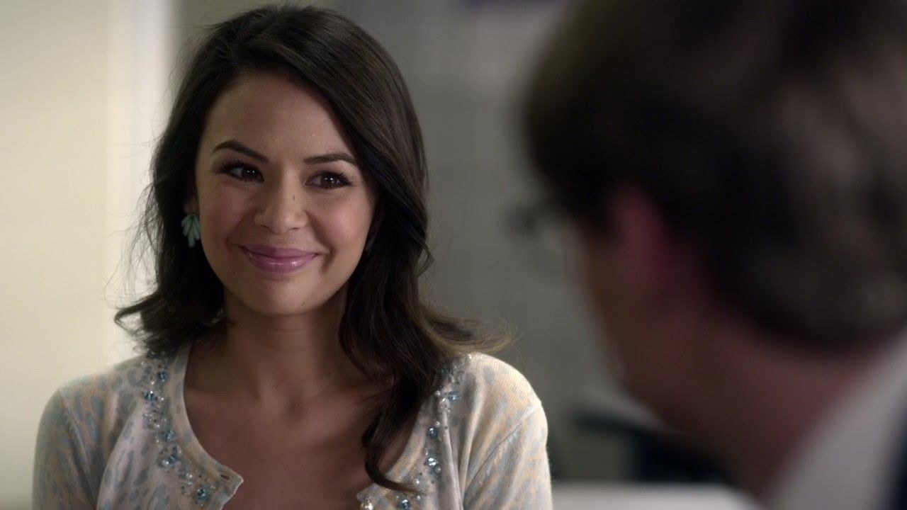 A still from PLL - Mona smiles sweetly at a man we can&#x27;t see