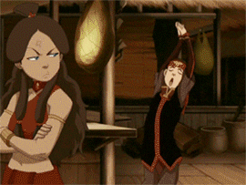 Sokka dancing while Katara glares at him in Avatar: The Last Airbender