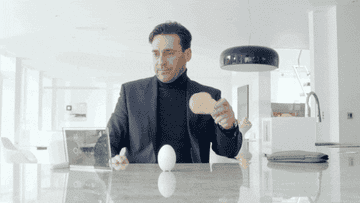 John Hamm holding a piece of toast in the Black Mirror episode &quot;White Christmas&quot;