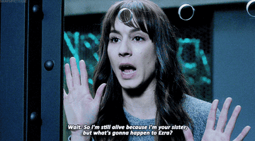 A gif of Spencer trapped behind a glass wall saying &quot;so I&#x27;m still alive because I&#x27;m your sister, but what&#x27;s gonna happen to Ezra?&quot;