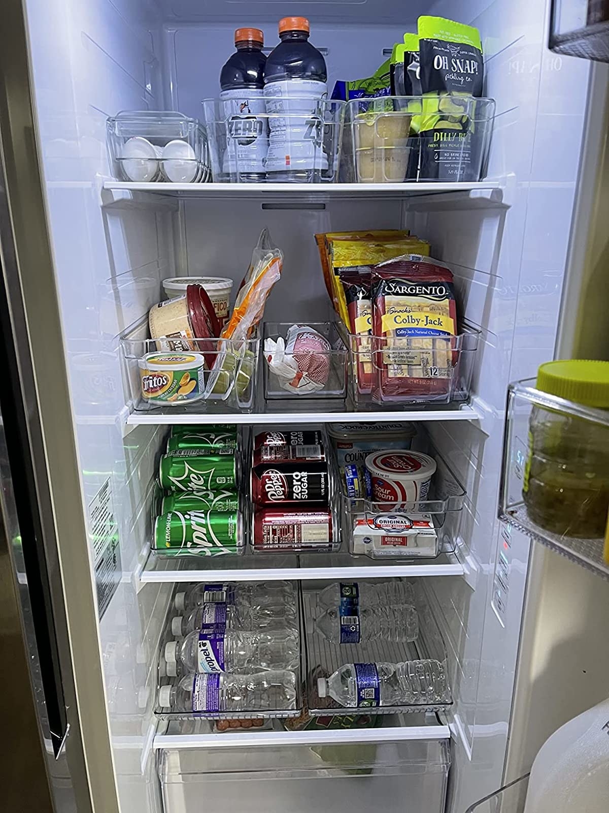 The reviewer shows a very well-organized fridge using the containers