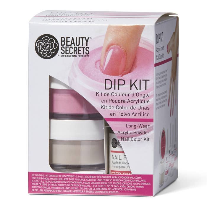 Box of dip kit showing a finger going into the nail powder