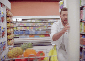 Justin Timberlake dancing in a store