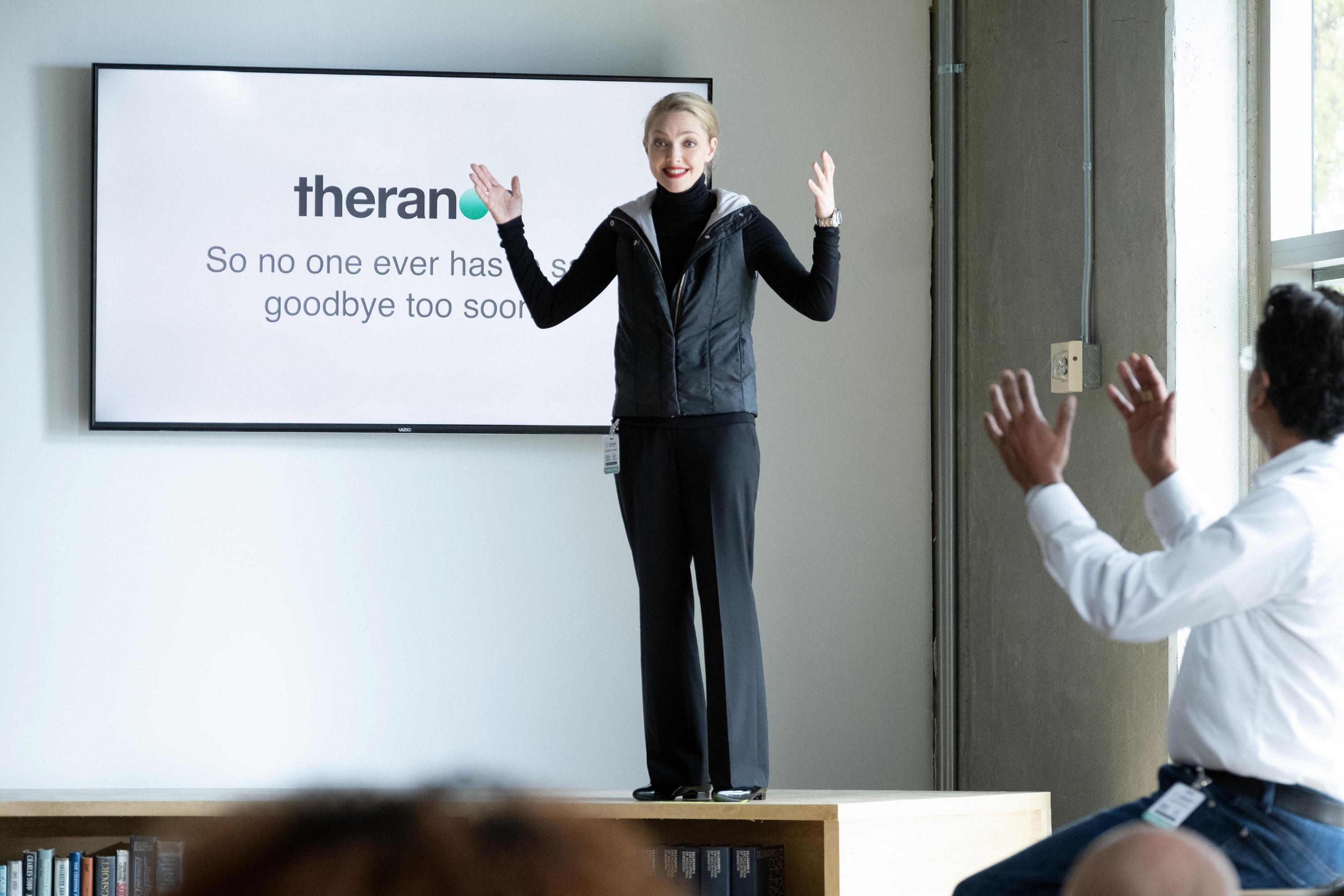 Seyfried as Holmes during a theranos presentation
