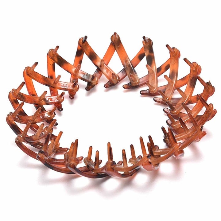 One of the bird nest holders expanded to show the design and bristles