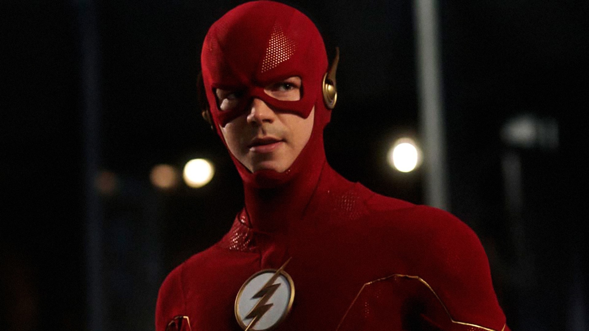 The Flash standing in his costume