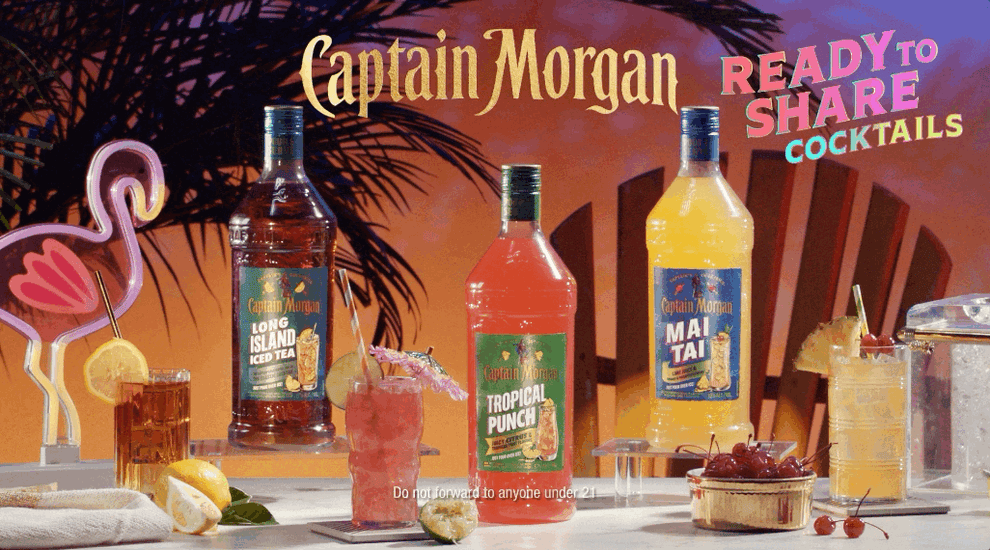 Captain Morgan Long Island Iced Tea, Tropical Punch, and Mai Tai Ready to Share Cocktails on a tropical spread