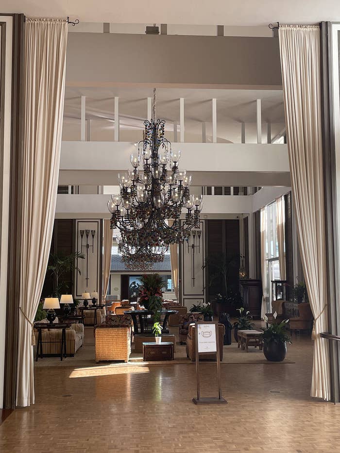 A hotel lobby with a large chandelier made with lava glass