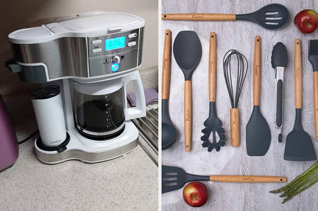 on left, double-sided coffee maker with travel mug on left and filled coffee pot on right. on right, blue kitchen utensils on table