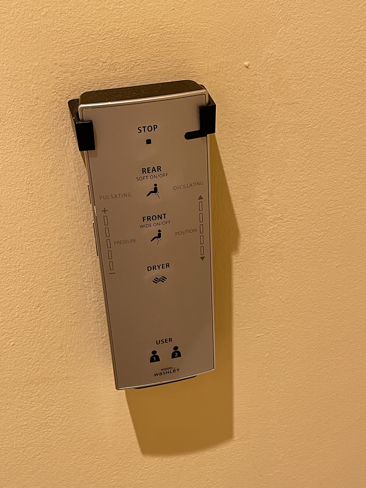A remote control for a Toto Washlet bidet including water pressure and position controls and a button for a dryer