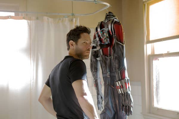 with his Ant-Man suit hanging from the shower rod, Scott Lang looks carefully over his shoulder