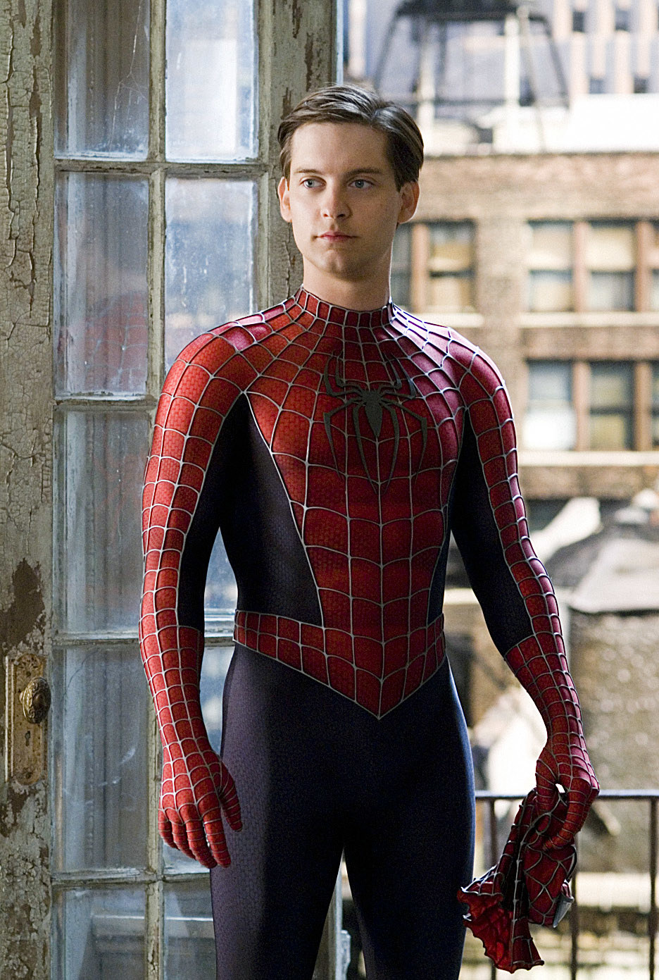 Peter stands in his Spidey suit, unmasked