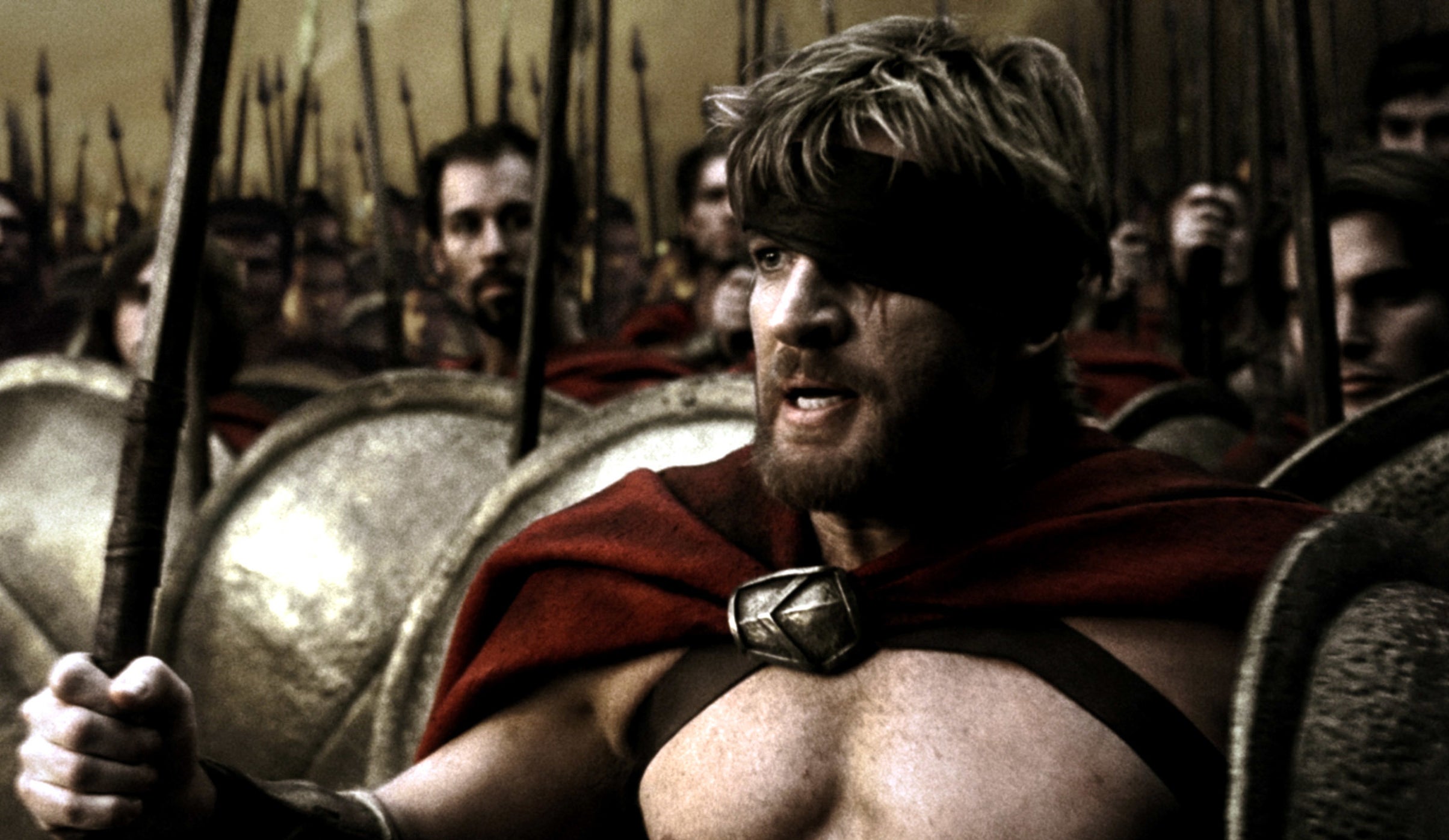 David Wenham in 300 holding a weapon and shield