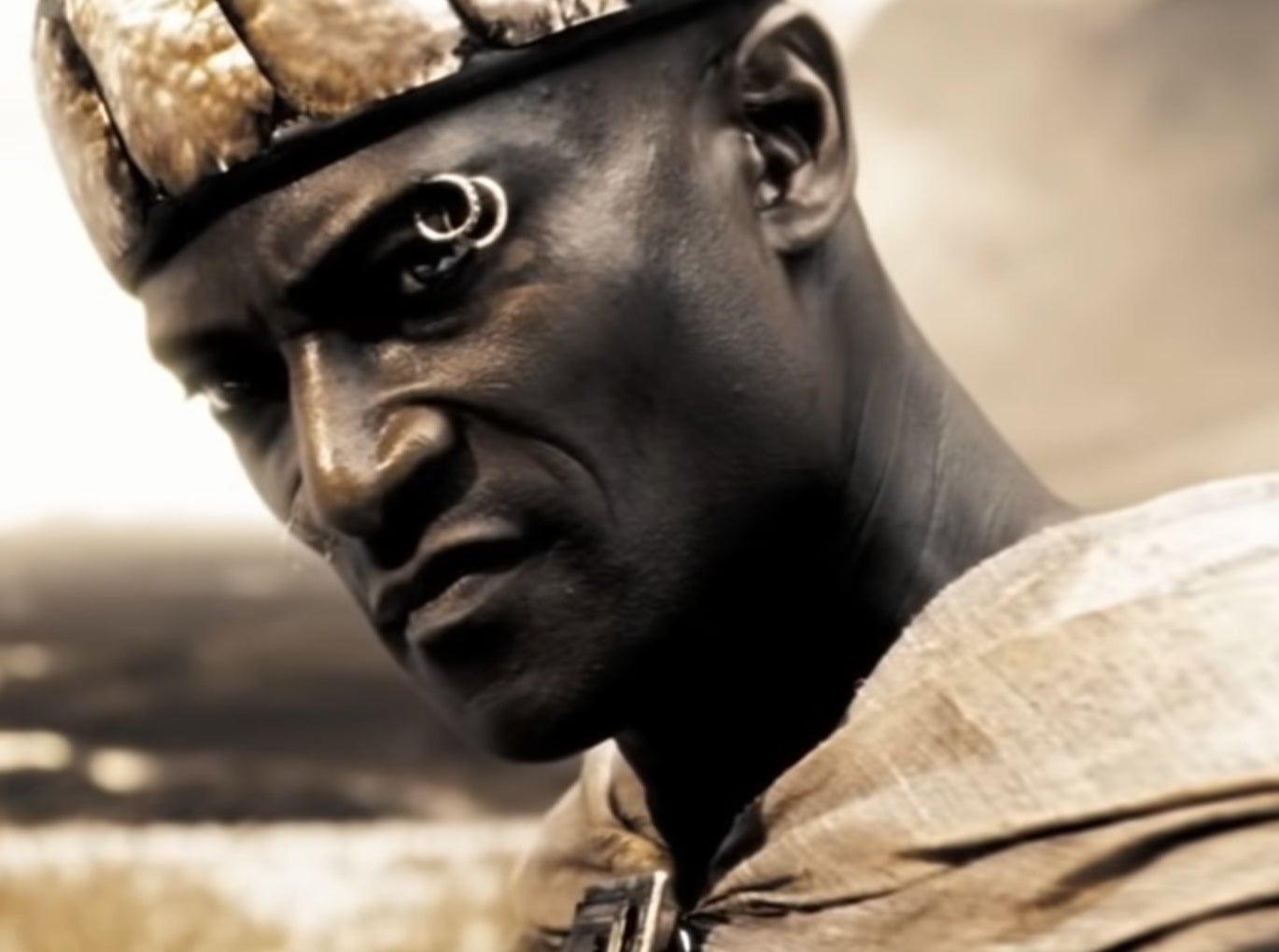 Peter Mensah in 300 with two rings through his eyebrows