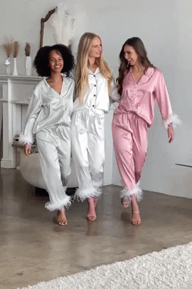 a gif of models wearing three different colors of pajamas