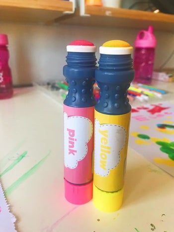 reviewer's photo of the pink and yellow paint pens