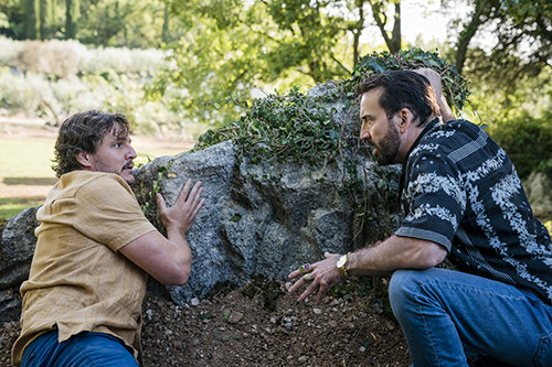 Pedro Pascal as Javi and Nicolas Cage as the fictionalized version of himself in &quot;The Unbearable Weight of Massive Talent&quot;