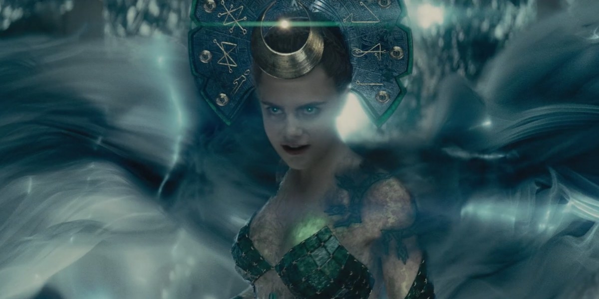 Cara Delevingne as Enchantress standing in the midst of a storm