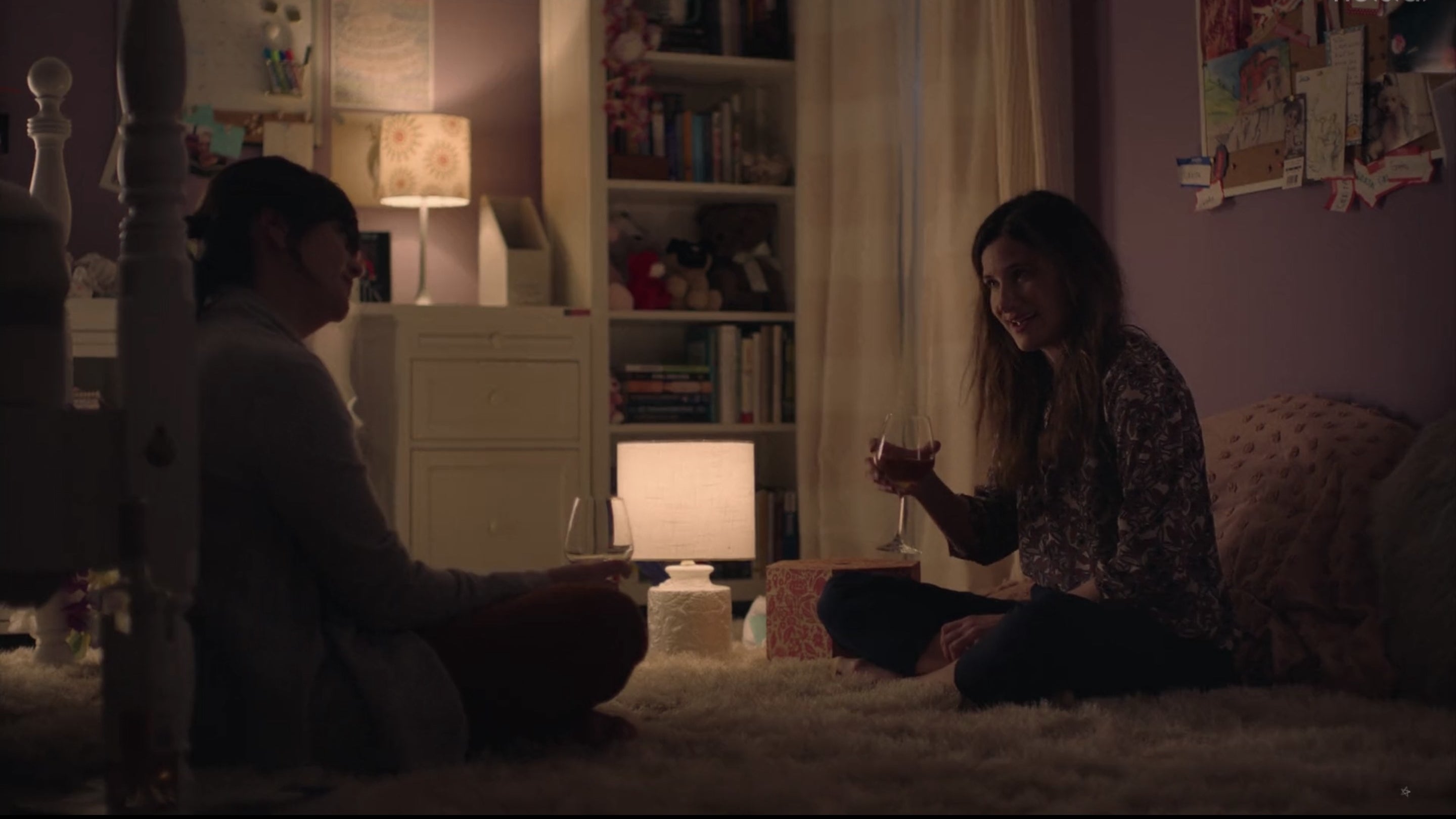 Kathryn Hahn's character, talking to someone while holding a glass of wine