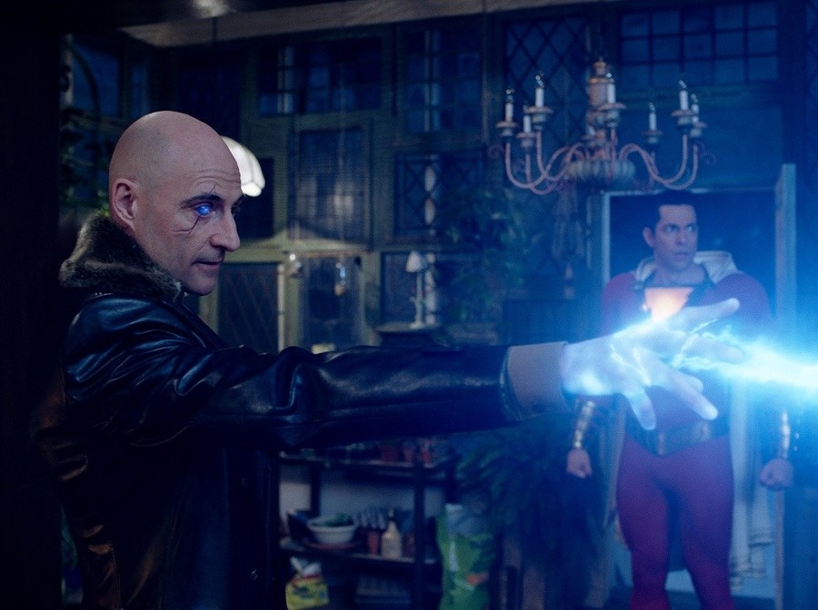 Mark Strong as Dr Sivana fires electricity out of his hand as Shazam played by Zachary Levi looks on