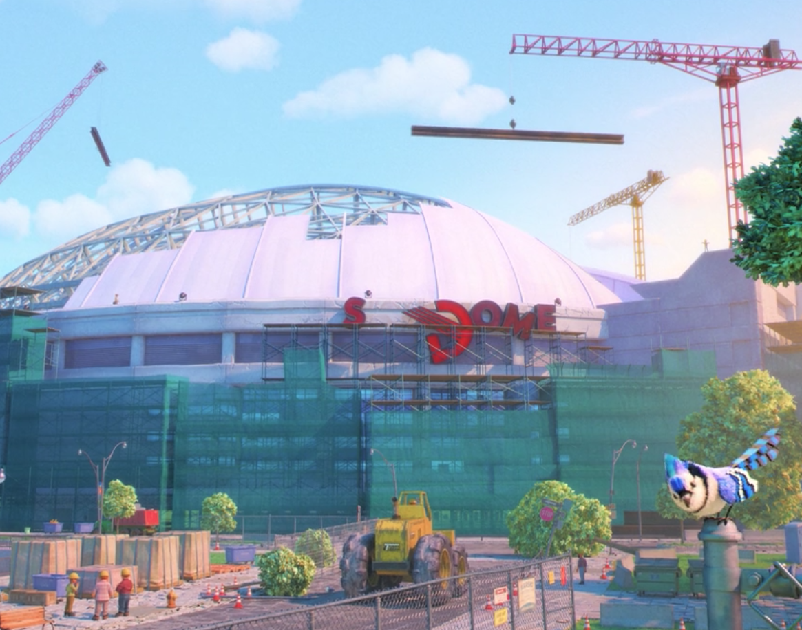 A blue jay on a fence post in front of the SkyDome, which has been demolished because of what happens in the movie; cranes are seen above the SkyDome