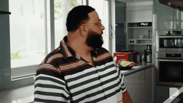 A GIF of  DJ Khaled taking off his sunglasses and saying whoo