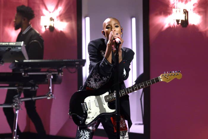 Willow Smith performing with a guitar onstage