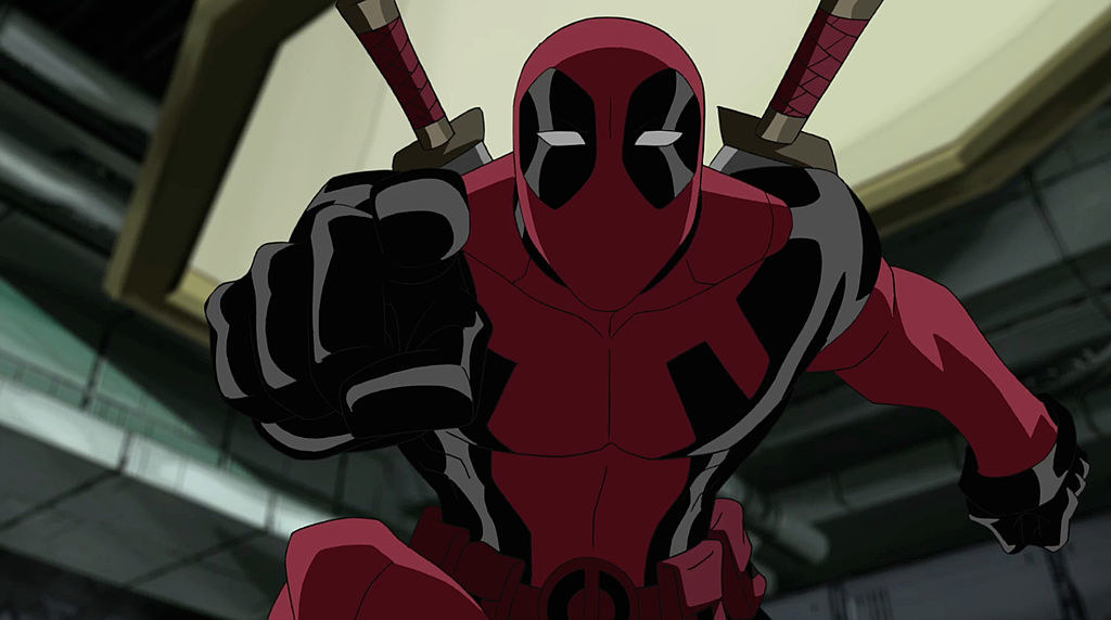 Deadpool narrows his eyes and points