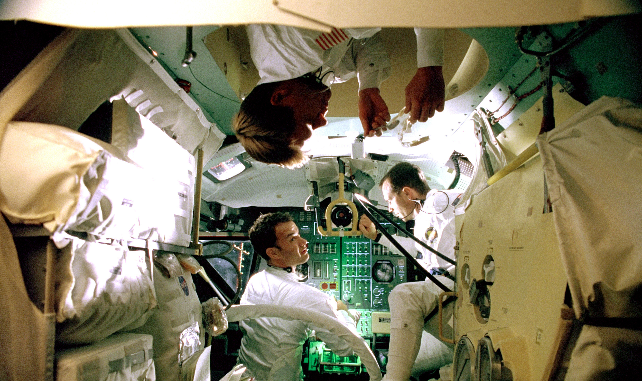 the astronauts floating in the capsule