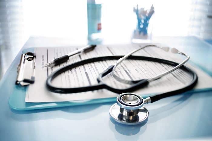 a stethoscope and a clipboard of papers