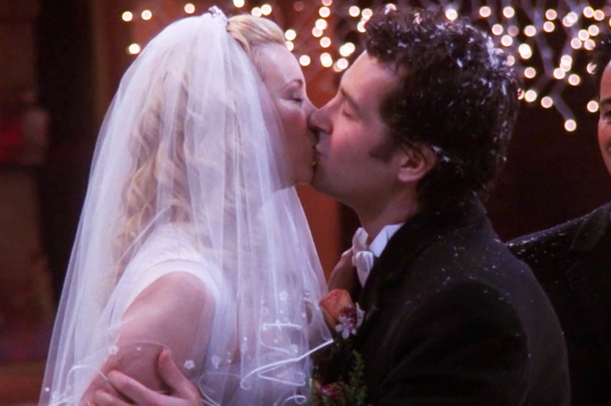 Phoebe and Mike from Friends kissing on their wedding day