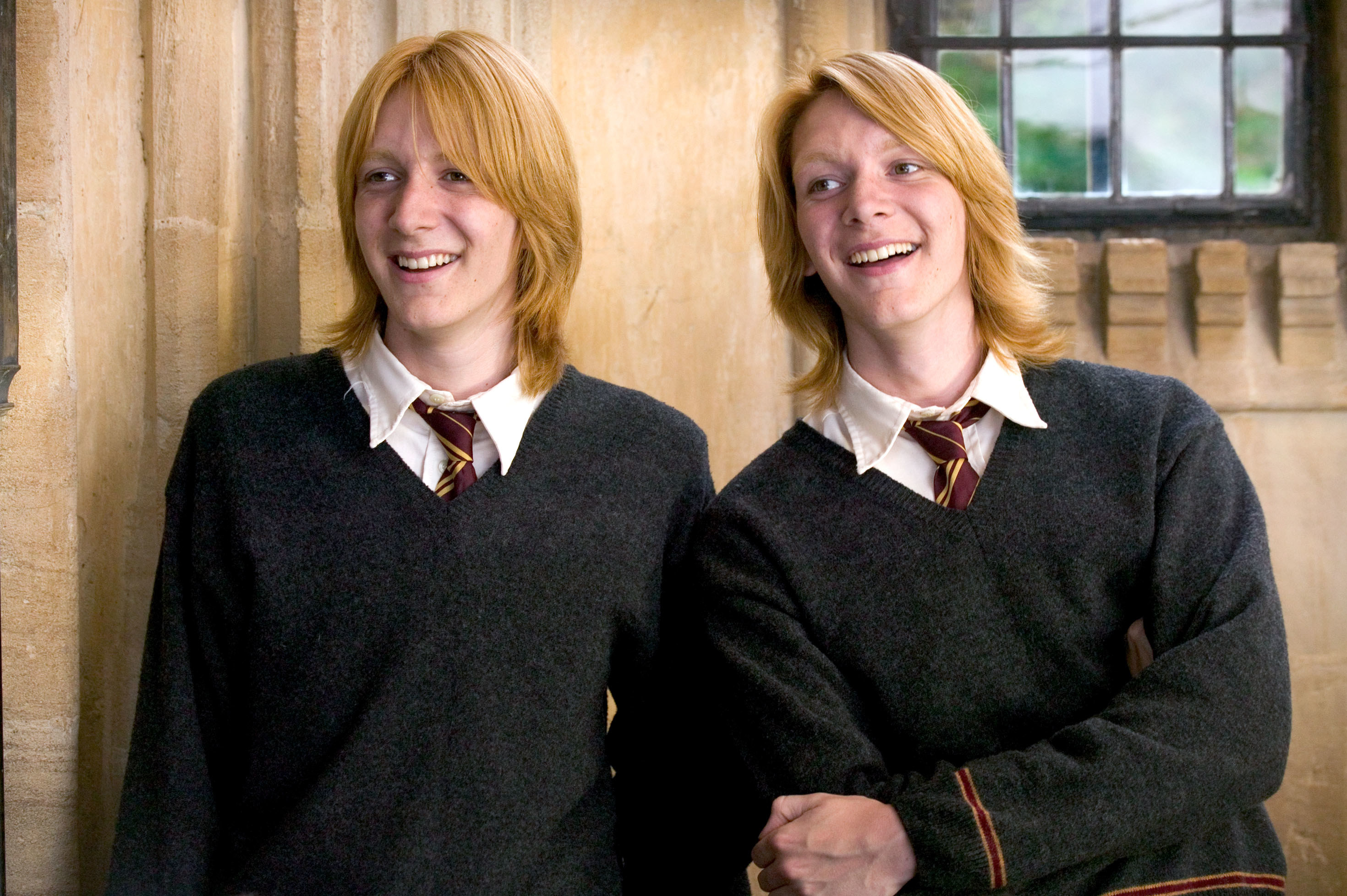 Fred and George smiling together