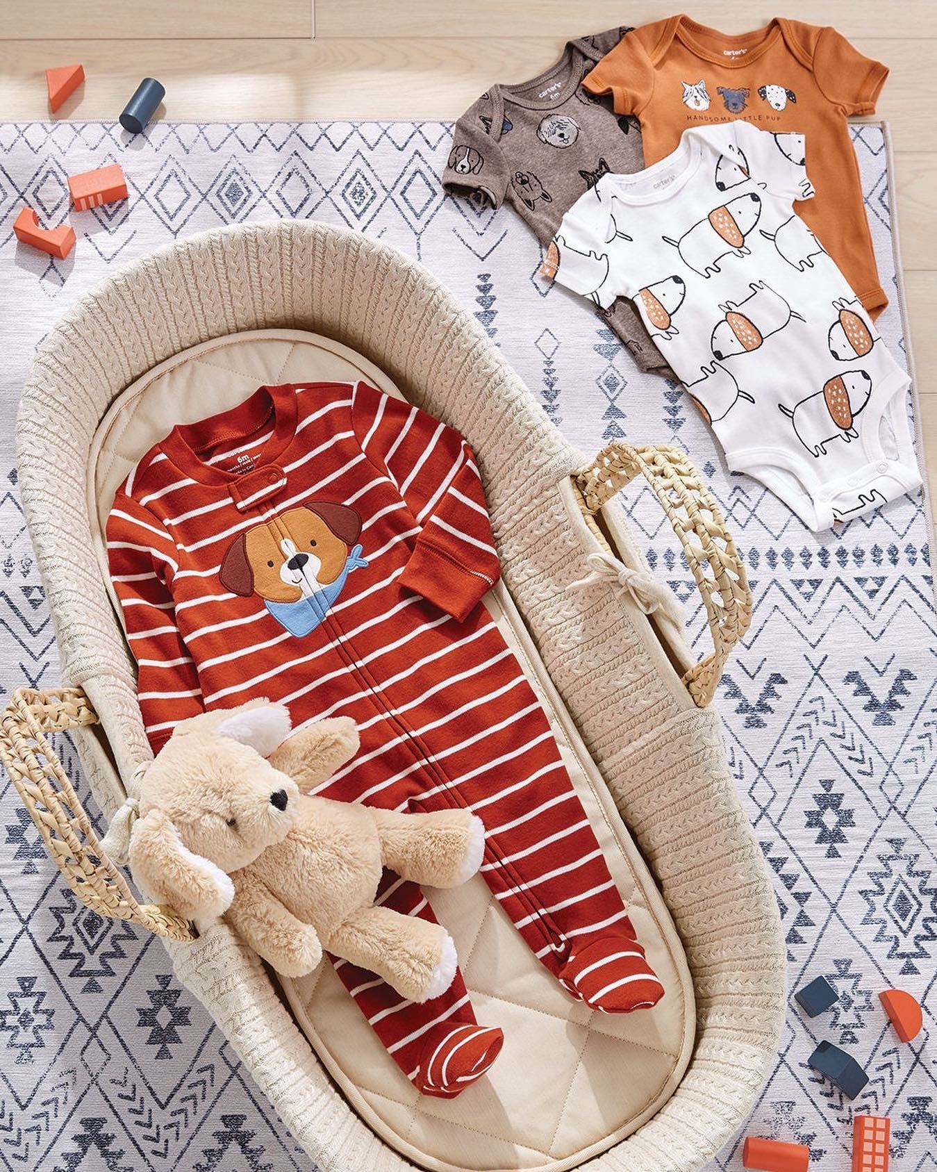 a red one piece outfit with a puppy in the middle and white horizontal stripes