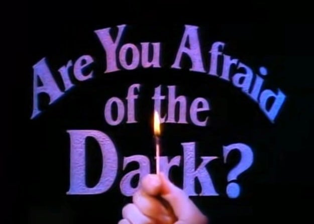 The logo for Are You Afraid of the Dark with a hand holding a matchstick 