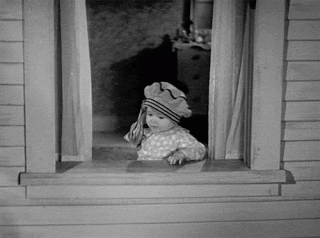 GIF of a child throwing money out of a window in black and white in the show &quot;Our Gang&quot;