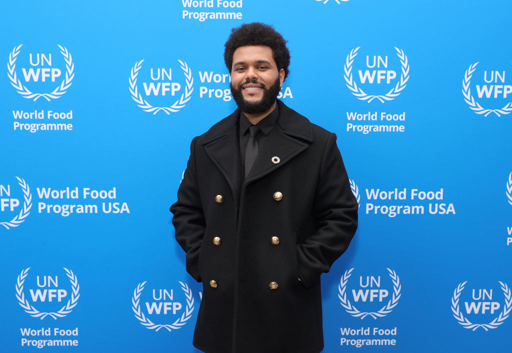 The Weeknd has his hands in his coat pocket for the World Food Program USA event