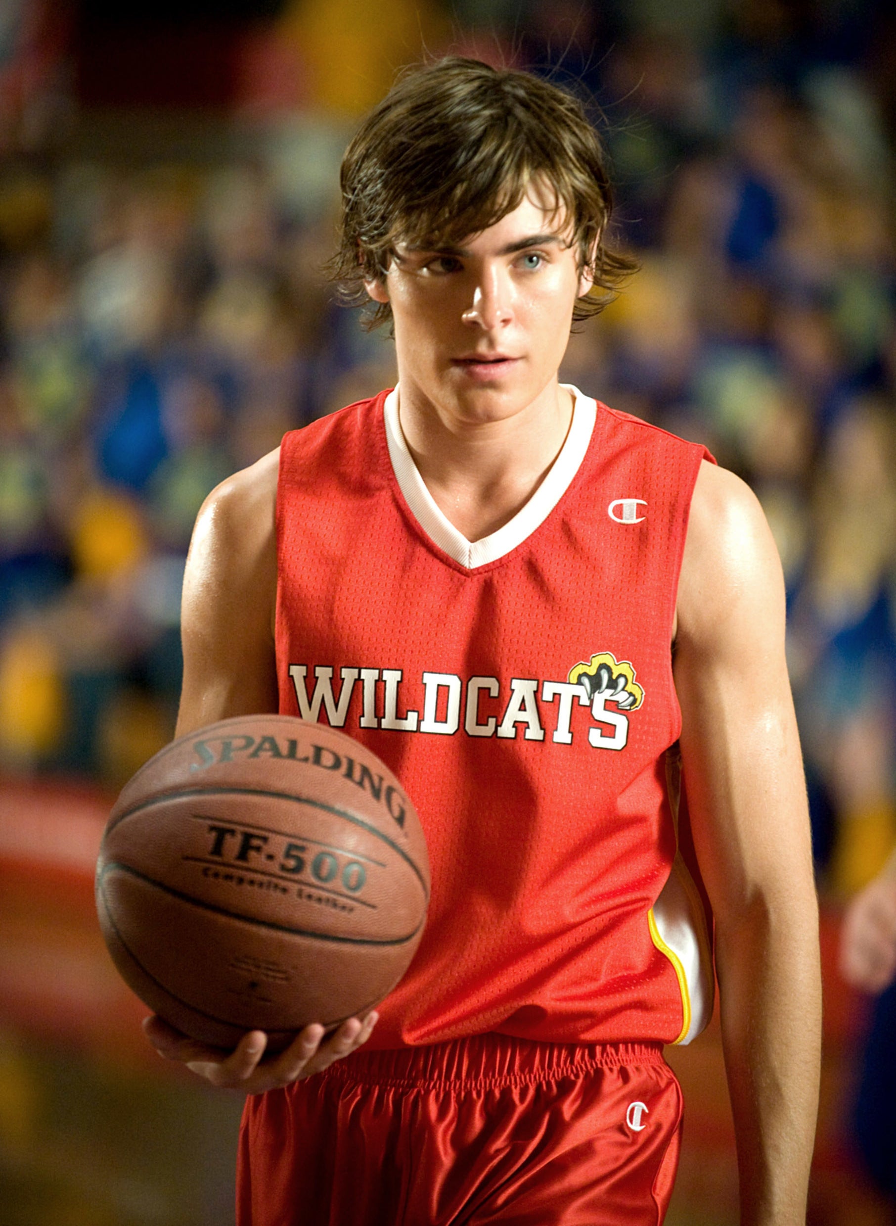 Zac Efron as Troy wearing a Wildcats basketball jersey in &quot;High School Musical 3&quot;