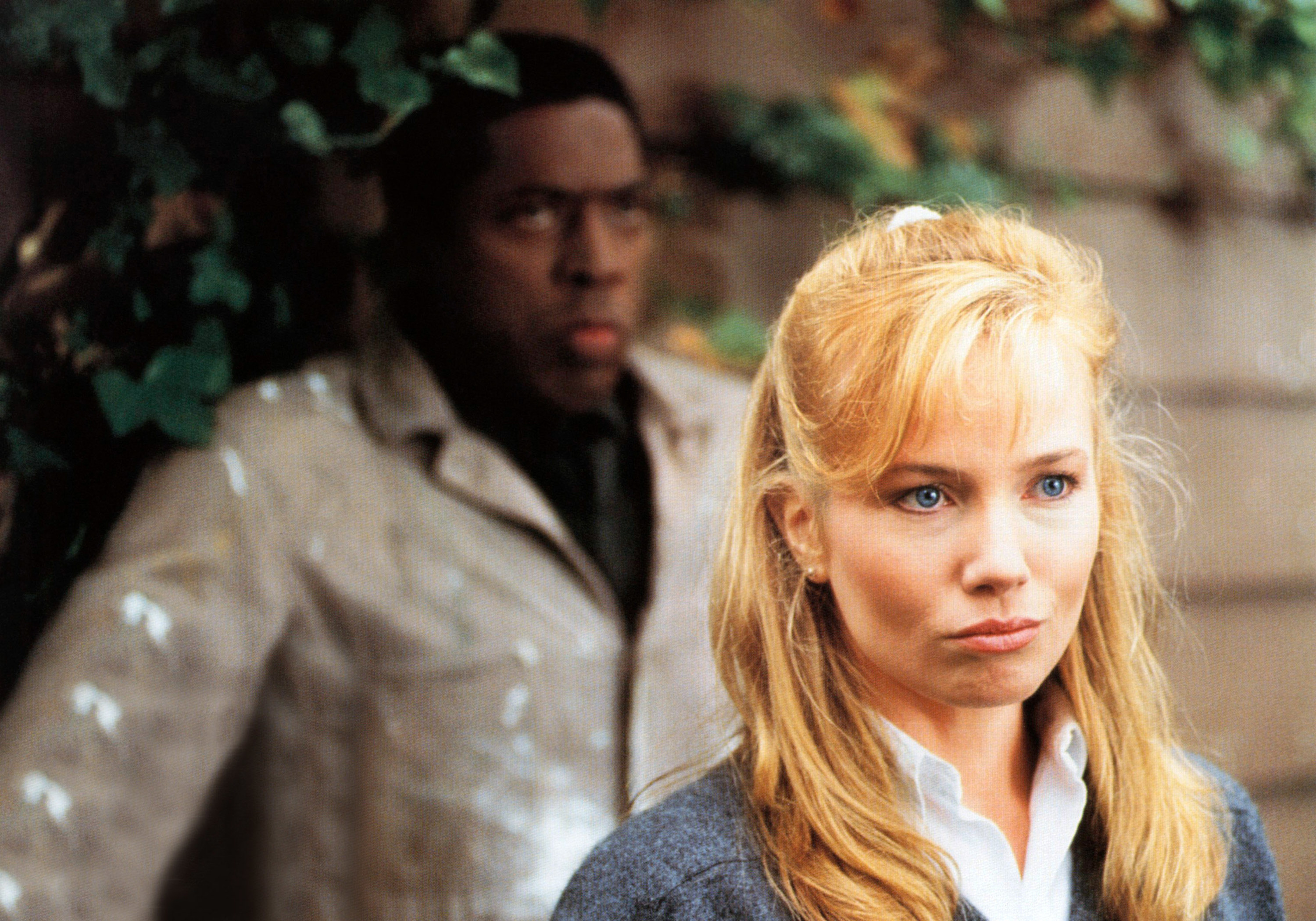 Rebecca De Mornay and Ernie Hudson look at something