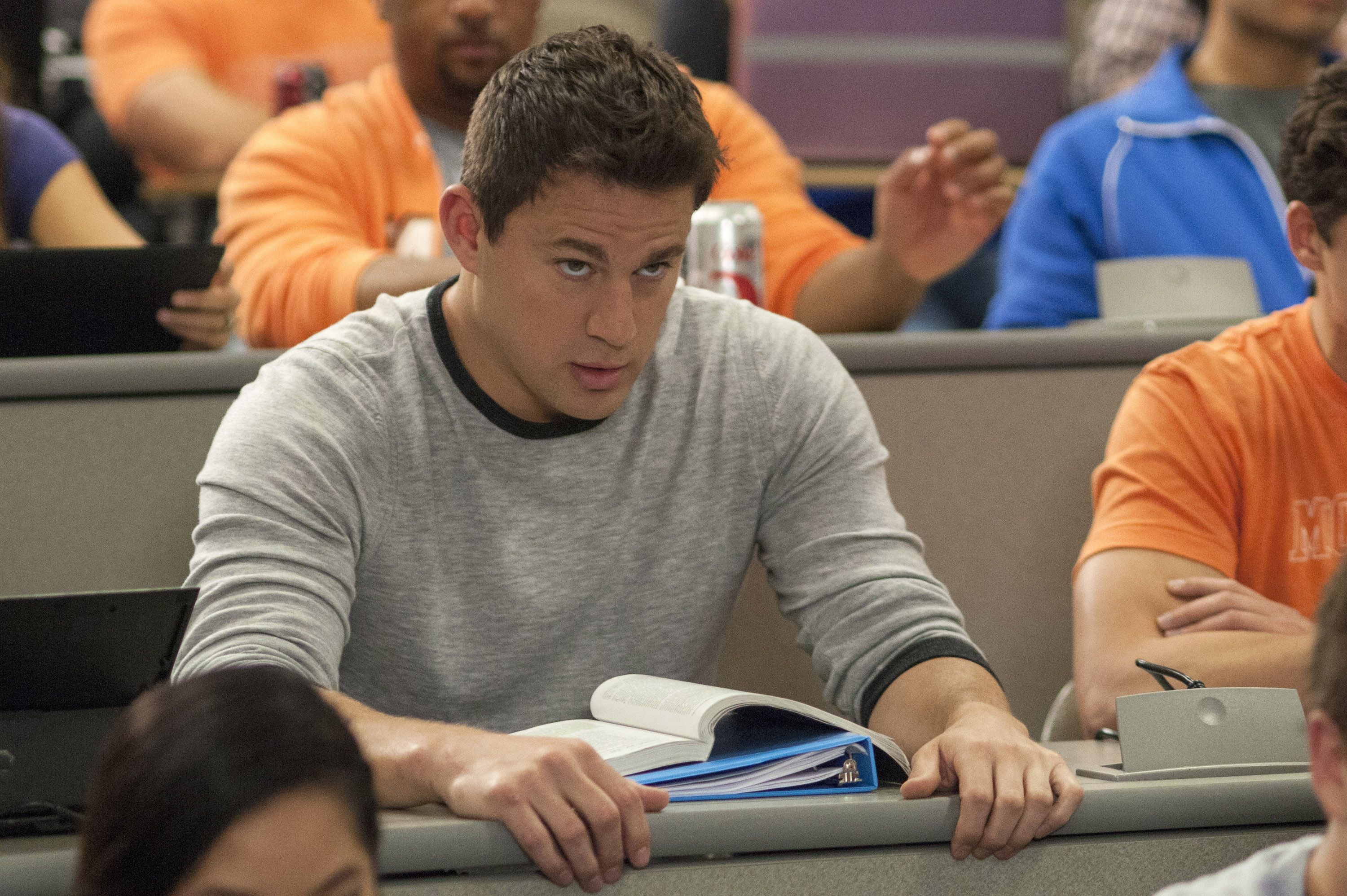 Tatum sitting in a classroom with other students