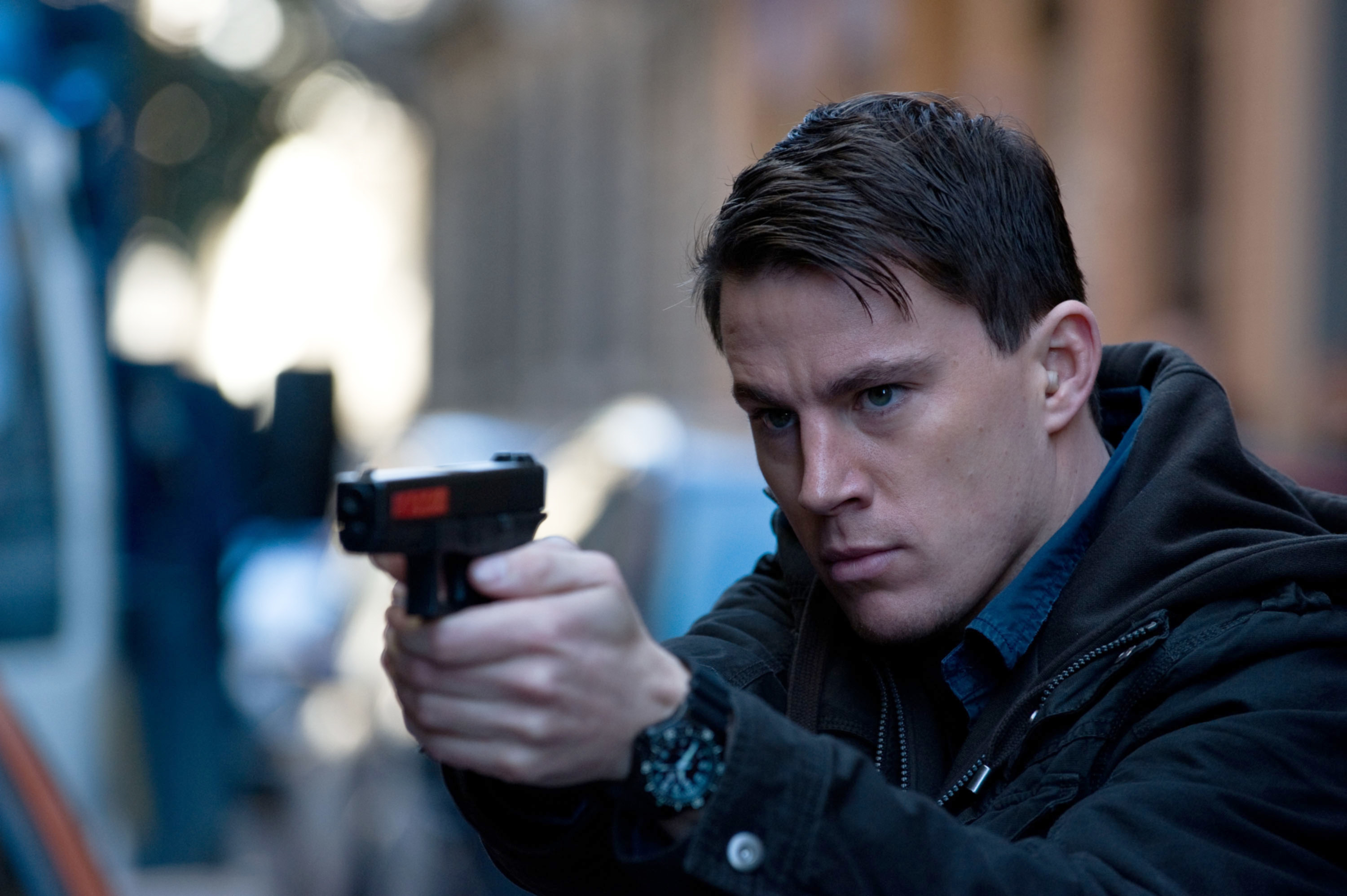 Channing Tatum pointing a gun