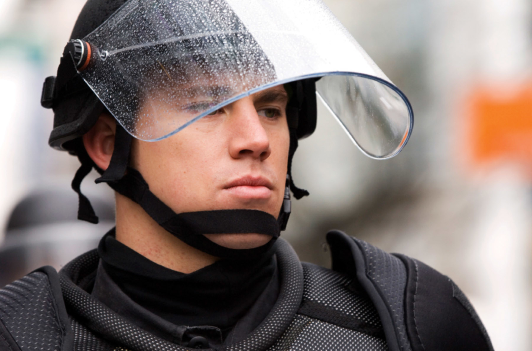Tatum wearing a police visor and bullet proof suit