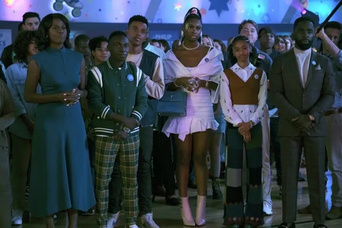 The Banks family stand together in party dress looking at something off camera in a still from &quot;Bel-Air&quot;