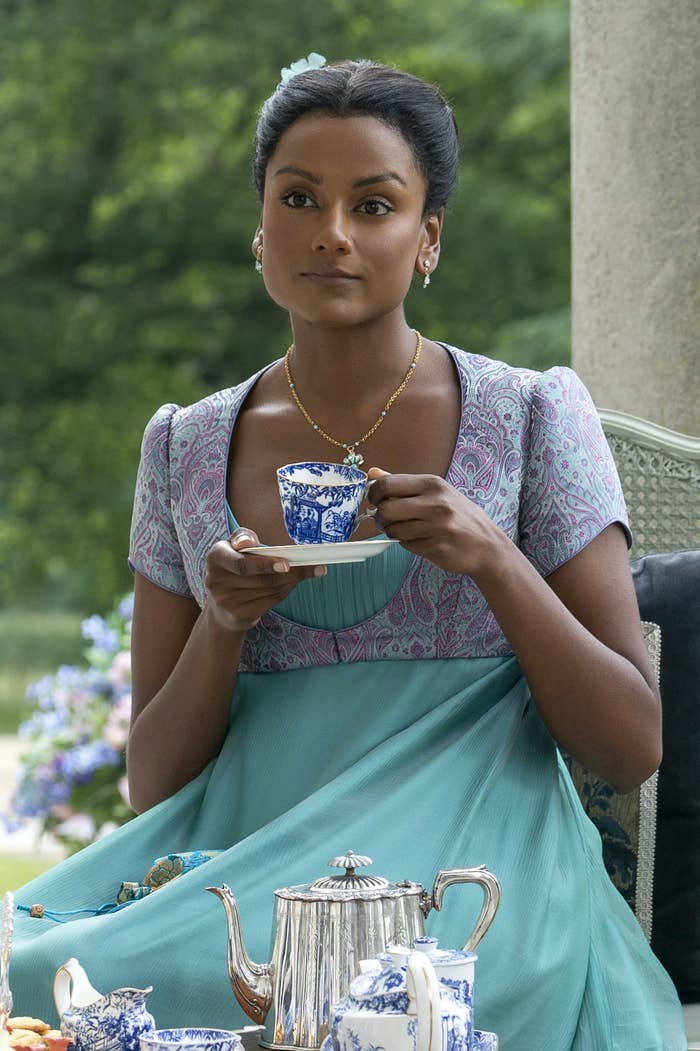 Simone Ashley in Bridgerton having a cup of tea