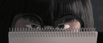 a gif of Edna Mode from the incredibles glaring over the edge of her notebook