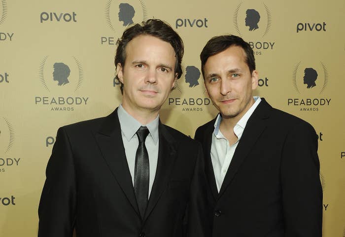 Two men in suits on the red carpet