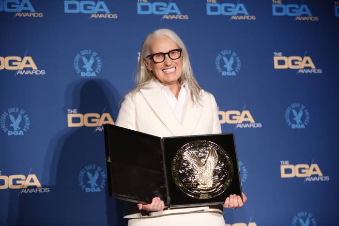 Campion holding her trophy on the red carpet at the DGA Awards