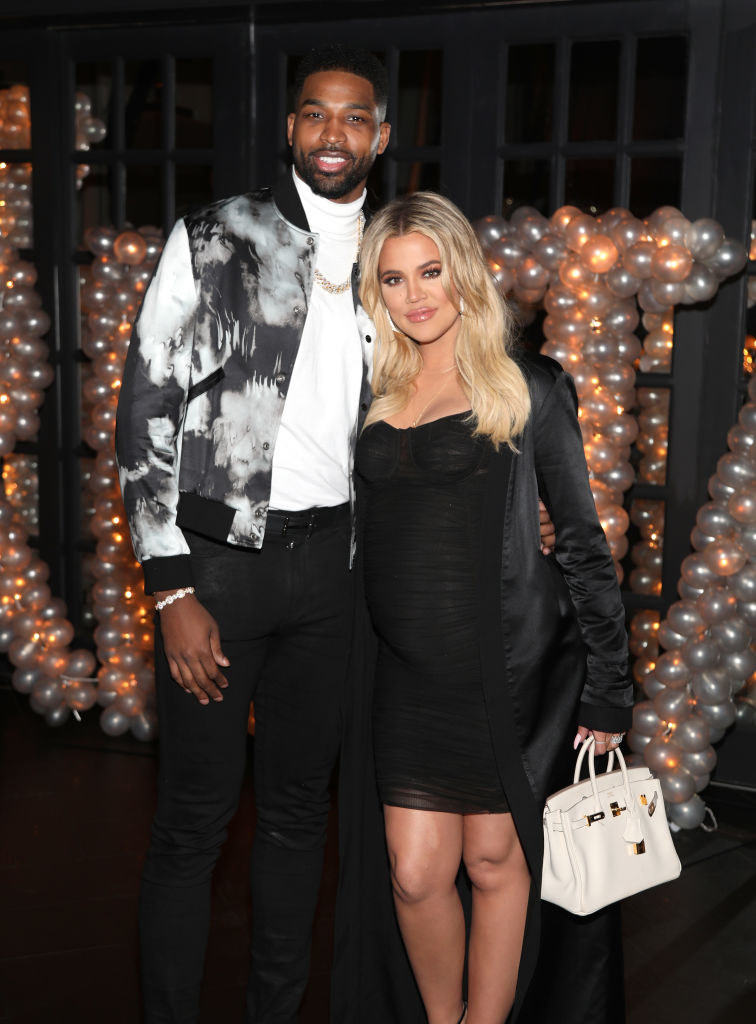 Smiling Tristan and Khloé embrace at his 2018 birthday bash