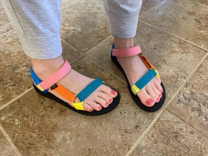 A reviewer photo of multi-colored Teva sandals