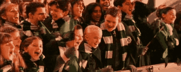 Draco Malfoy, Crabb and Goyle cheering in Slytherin attire